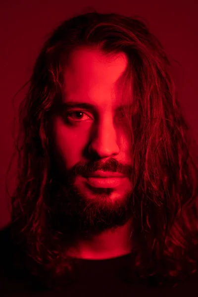 Portrait Red Illuminated Young Man Red Background — Stok Foto