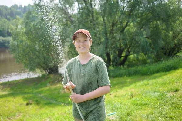 Smiling Boy Holding Hose While Standing Forest — Stock Photo, Image