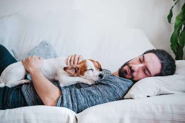 Man Napping Dog While Lying Sofa Home — Stock Photo, Image