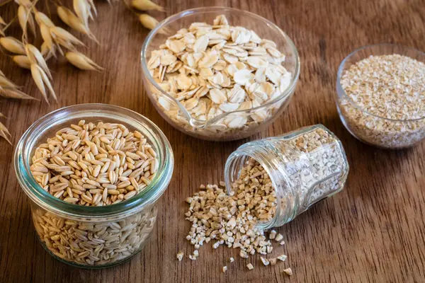 Bowls Jars Fresh Oats Lying Wooden Surface — Stock Photo, Image