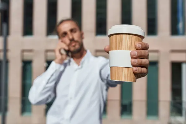 Businessman Showing Coffee Cup While Talking Smart Phone City — Foto Stock