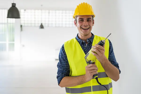 Smiling Man Holding Drill Machine While Standing Office Construction — Stock Photo, Image
