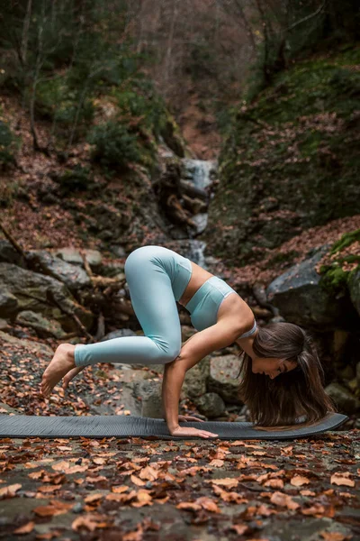 Athlete Doing Crow Pose Exercise Mat Waterfall Forest — Stock Photo, Image