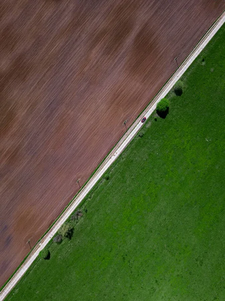 Aerial View Car Driving Countryside Road Stretching Green Brown Field — Stock Photo, Image