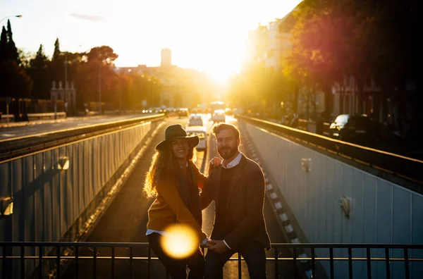 Couple Holding Hands While Sitting Bridge Railing Together City Sunset —  Fotos de Stock