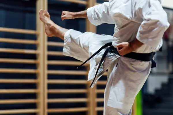 Mature Man Kicking While Practicing Karate Class — Stock Photo, Image