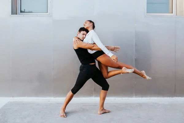 Young Professional Acrobats Embracing Each Other While Dancing Wall — Stock Photo, Image