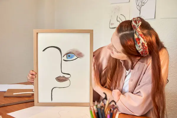 Female Artist Showing Drawing Art Picture Frame Wall Home — Stock Photo, Image