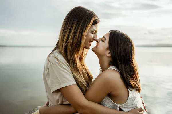 Mother Daughter Nuzzling Nose Lake Sky — Stock Photo, Image