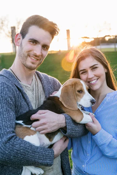 Mid Adult Couple Smiling While Standing Dog Park Sunset — Stock Photo, Image