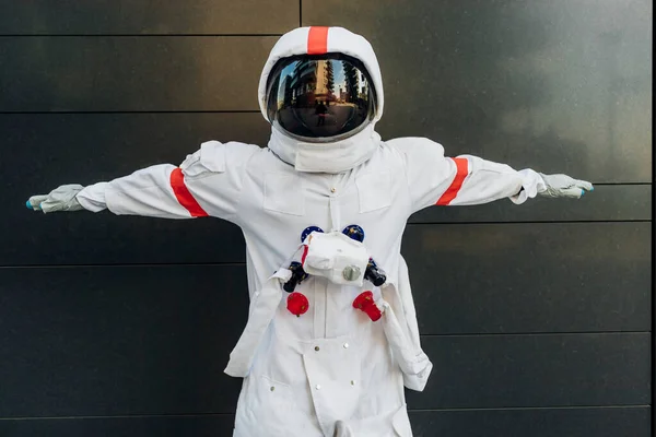 Male Astronaut Arms Outstretched Wearing Space Helmet Standing Wall — 스톡 사진