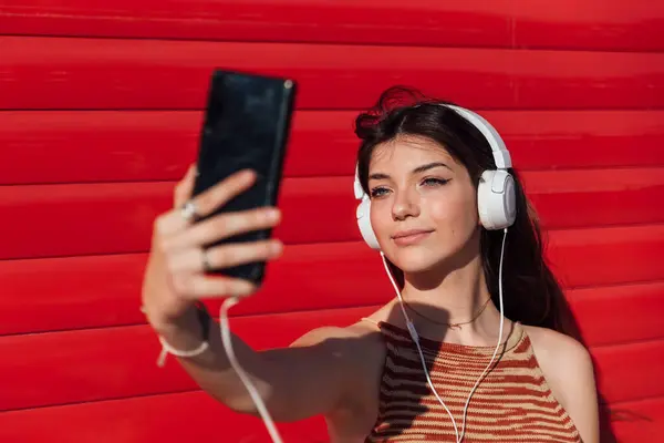 Smiling Teenage Girl Taking Selfie Smart Phone While Listening Music — Stock Photo, Image