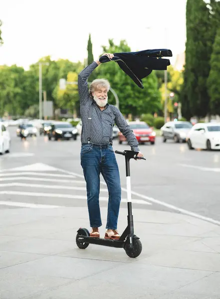 Happy Mature Man Swinging Jacket While Riding Scooter Street — Stock Photo, Image