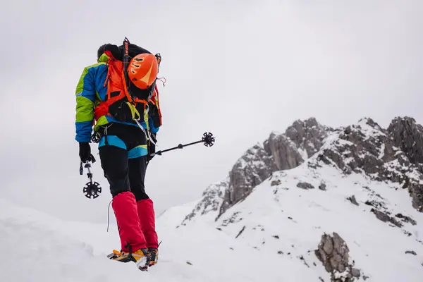 Mature Man Carrying Backpack While Walking Snowcapped Mountain Crampon Hiking — Stock Photo, Image