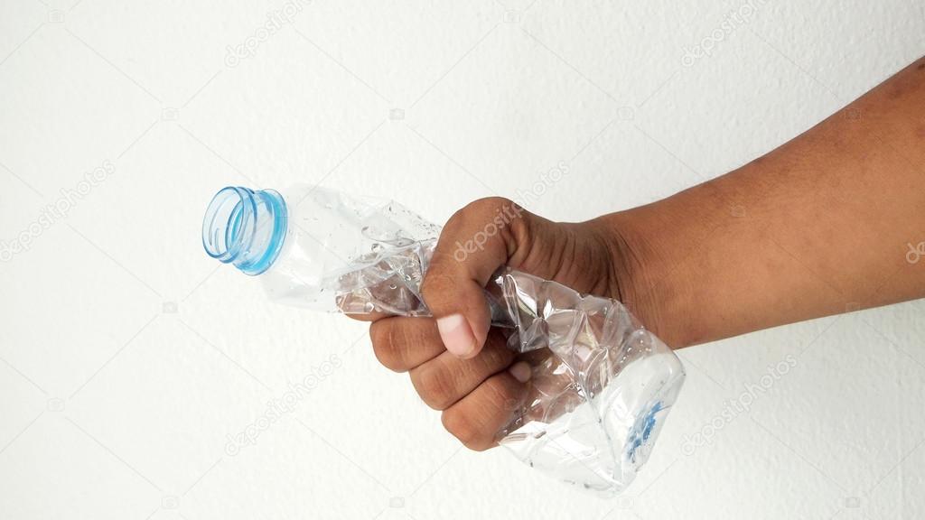 Hand squash a plastic bottle