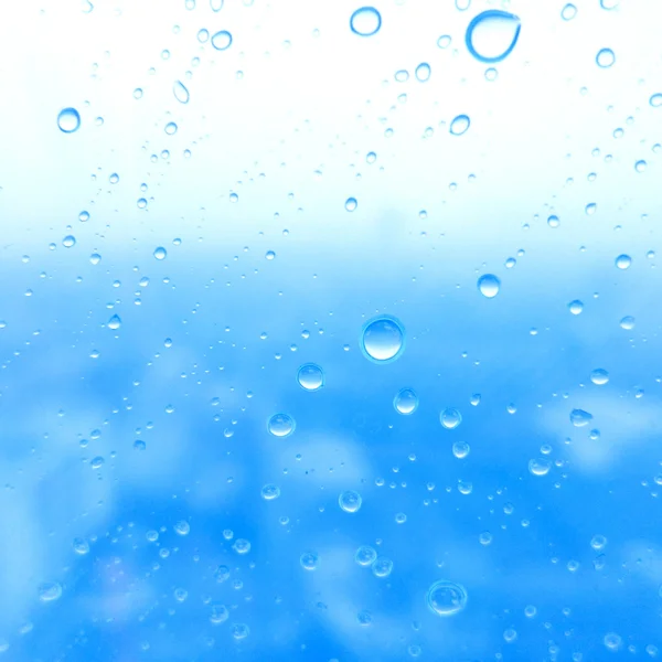 Detailní záběr kapek vody na skleněný povrch jako pozadí — Stock fotografie