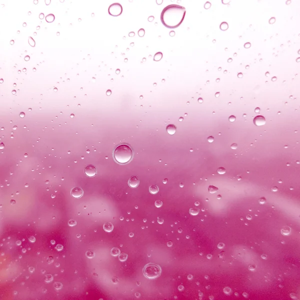 Close-up de gotas de água na superfície de vidro como fundo — Fotografia de Stock