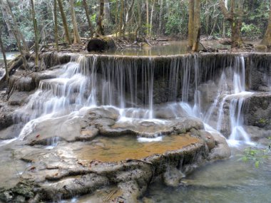 Water fall in spring season located in deep rain forest jungle