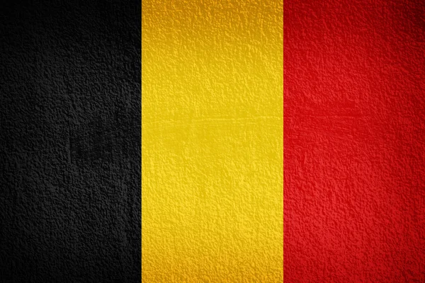 Die belgische Flagge auf Grunge-Wand gemalt — Stockfoto