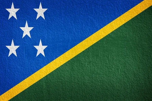 Solomon islands Flag on the old wall texture — Stock Photo, Image