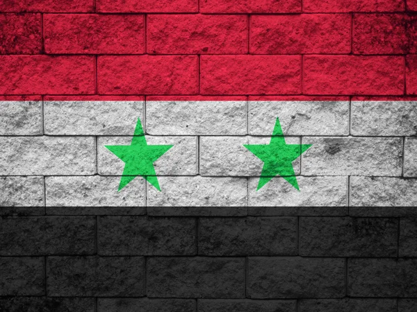 Vlag van Syrië geschilderd op een grunge bakstenen muur — Stockfoto