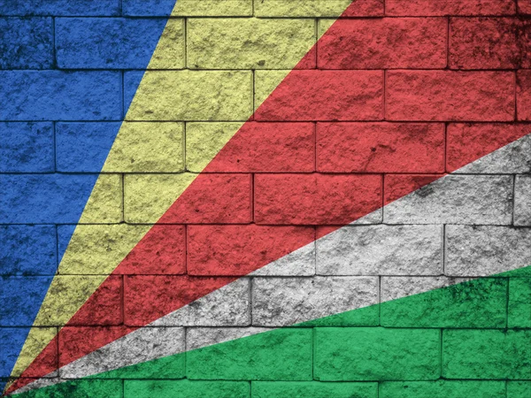 Vlag van de Seychellen op de oude muur textuur — Stockfoto