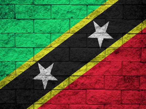 Saint Kitts und Nevis-Flagge auf Grunge-Wand gemalt — Stockfoto