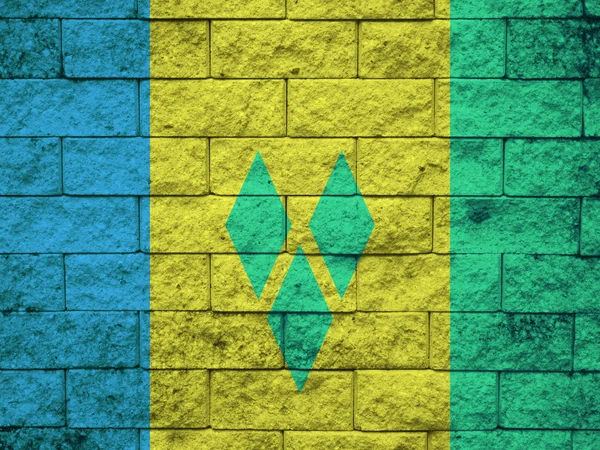 Saint vincent és Grenadine-szigetek zászló festett falra grunge — Stock Fotó