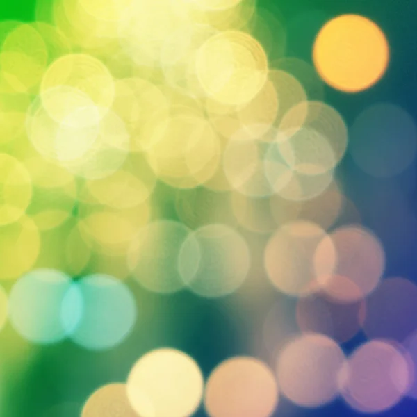 Yellow christmas background with bokeh lights — Stock Photo, Image