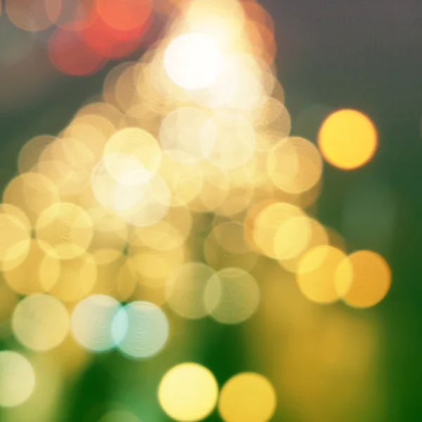 Yellow christmas background with bokeh lights — Stock Photo, Image