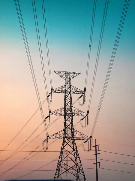 High voltage post.High-voltage tower and sunset — Stock Photo, Image