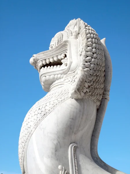 Bangkok, Thailand - June 1,2014 :The over 150 years ancient marble lion standing at front of main temple at Benjamaborphit temple — Stock Photo, Image