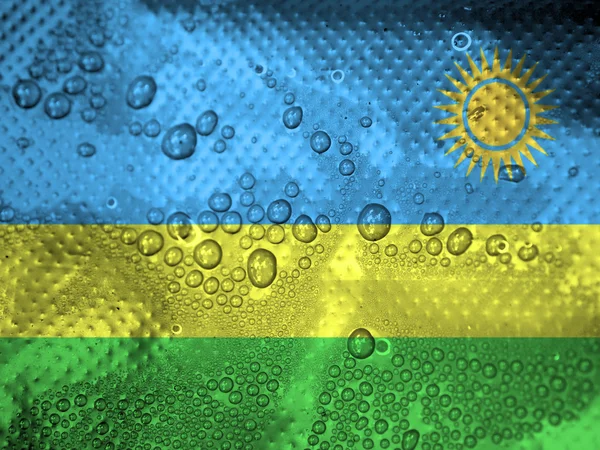 Gotas de água no fundo da bandeira do Ruanda — Fotografia de Stock