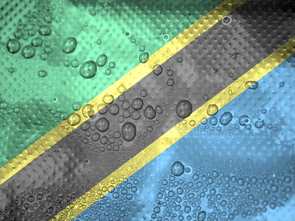 Water drops on Tanzania flag background — Stock Photo, Image