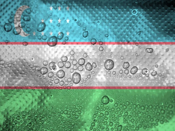 Краплі води на фоні прапор Узбекистану — стокове фото