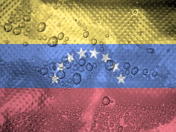 Gotas de agua sobre fondo de bandera de Venezuela — Foto de Stock