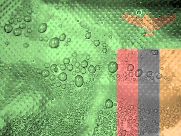 Water drops on Zambia flag background — Stock Photo, Image