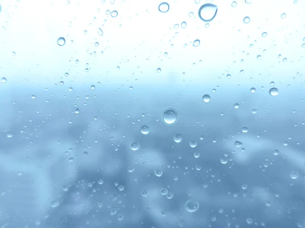 Close-up van waterdruppels op glasoppervlak als achtergrond — Stockfoto
