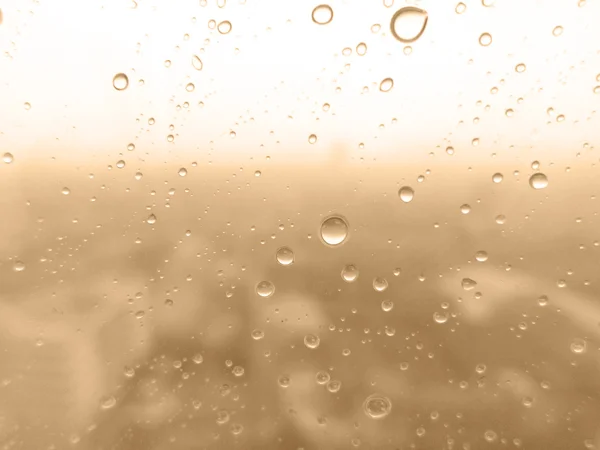 Close-up of water drops on glass surface as background — Stock Photo, Image