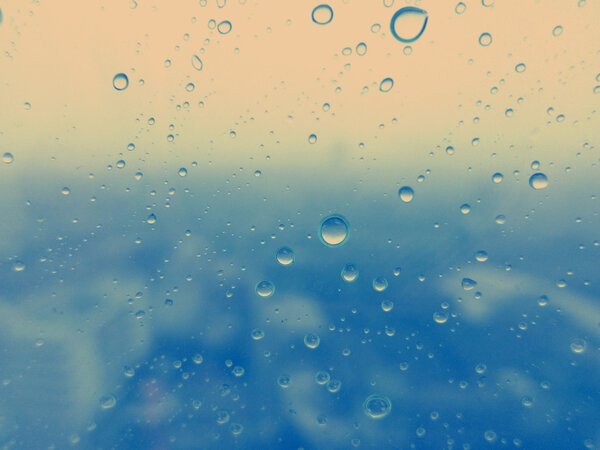 Close-up of water drops on glass surface as background