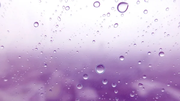 Close-up of water drops on glass surface as background — Stock Photo, Image