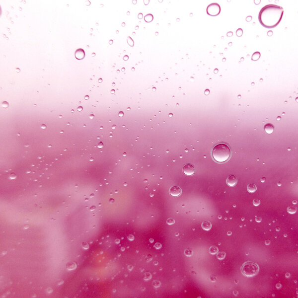 Close-up of water drops on glass surface as background