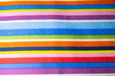 Çok renkli çizgili kumaş dokusu. Gökkuşağı kumaş dokusu. Renkli nakış, çok renkli iplikler.