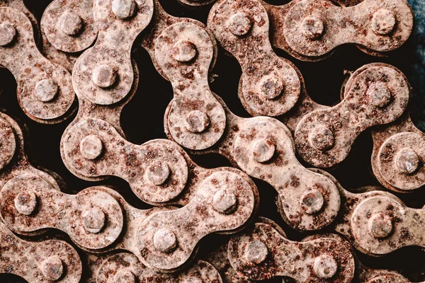 Rusty motorcycle chain. Old motorcycle chain with rust. Motorcycle parts unusable. Close-up.