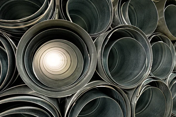 Metallic Pipes stacked in rows pattern — Stock Photo, Image