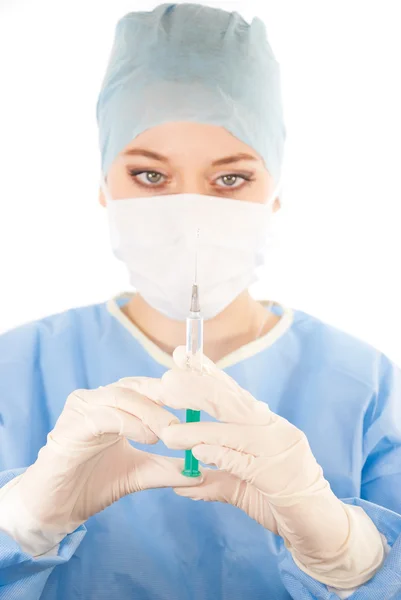 A young beautiful female doctor with a syringe — Stock Photo, Image