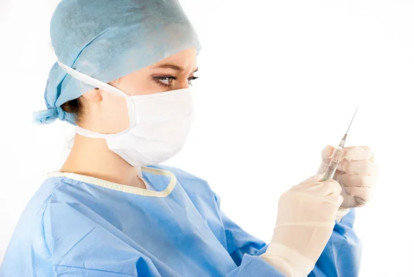 A young beautiful female doctor with a syringe — Stock Photo, Image