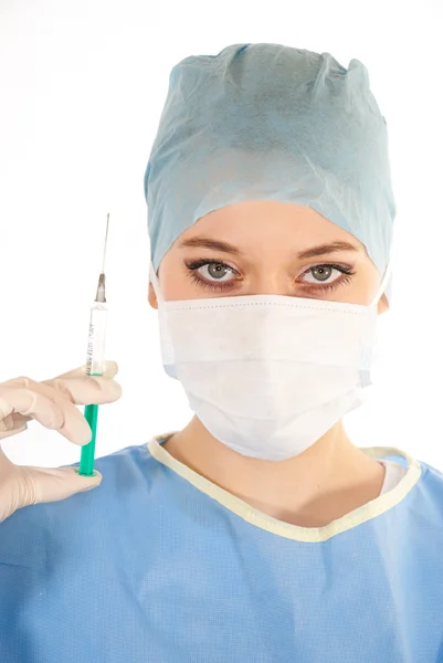 Uma jovem e bela médica com uma seringa Imagem De Stock