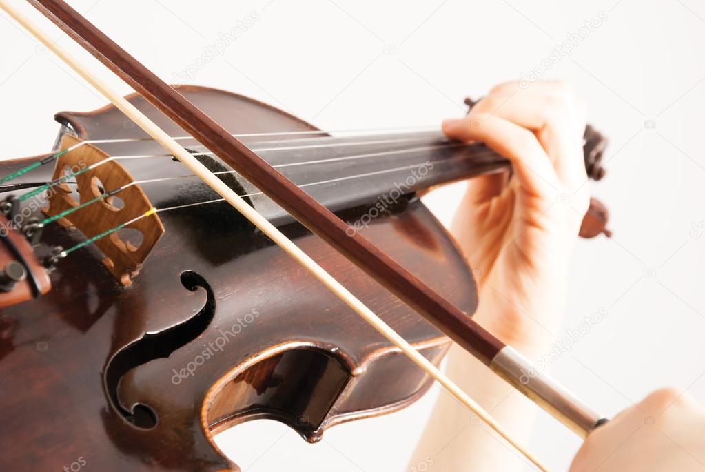 A female violinist playing a violin