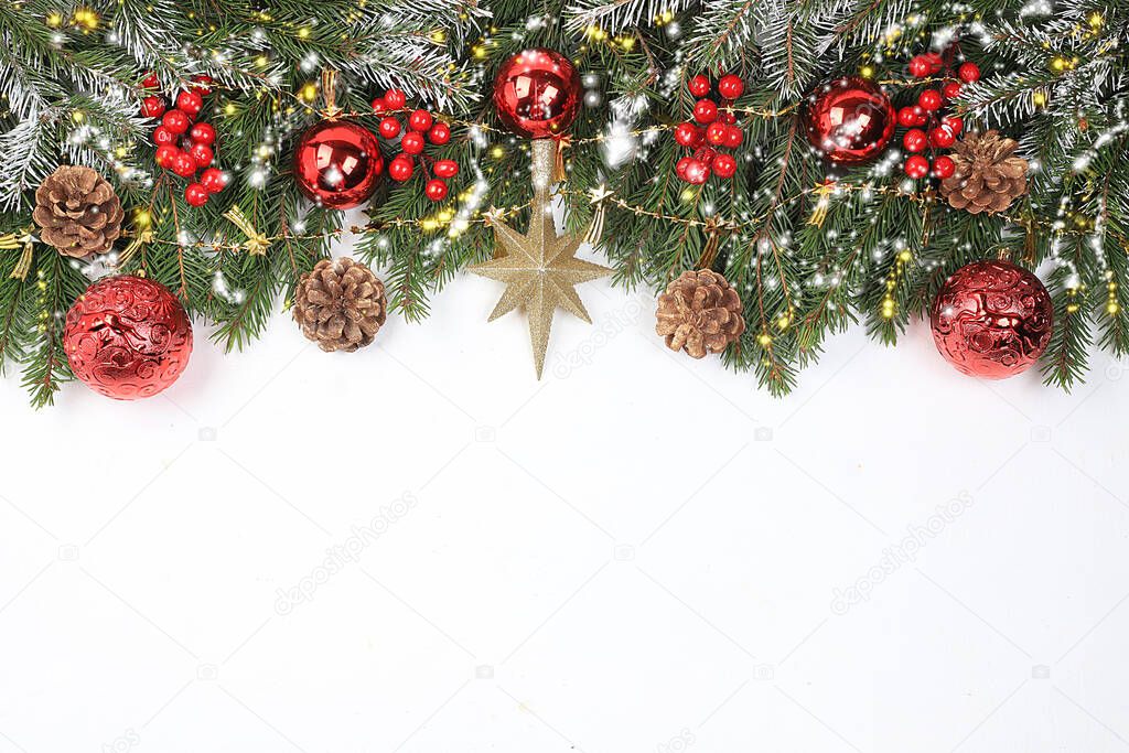 Christmas and New Year background with bokeh lights and decorations, toys with fir branches in snow flakes, place for text. Holiday card, selective focus,